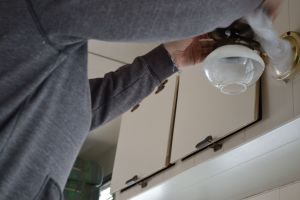Polishing the propane lantern over the dinette.