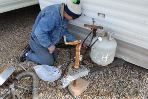 Mr. Handy attaching the new regulator.